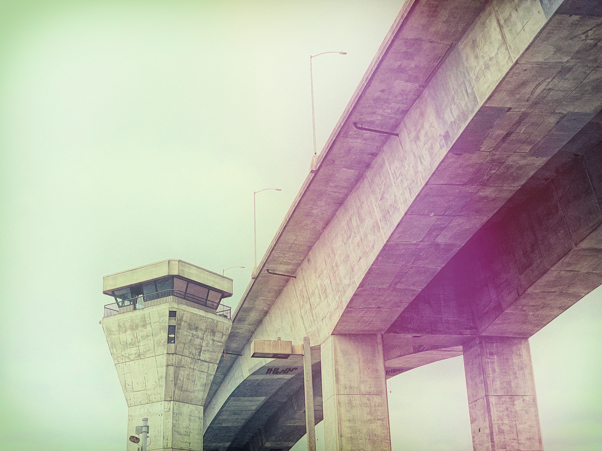 Looking up at bridge. Analog feel, with the sky washed out